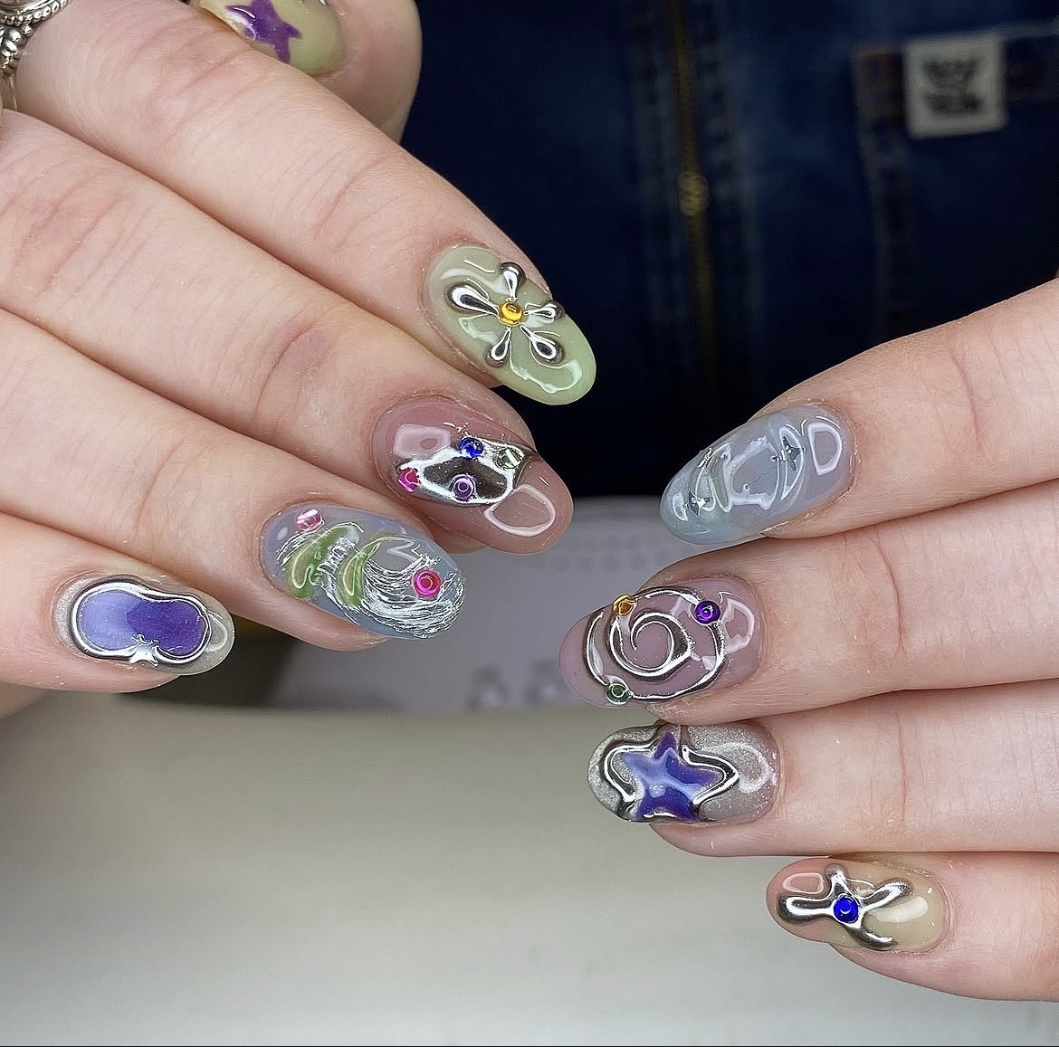 Mixed abstract nail art with silver linework by PUCA_NAILZ