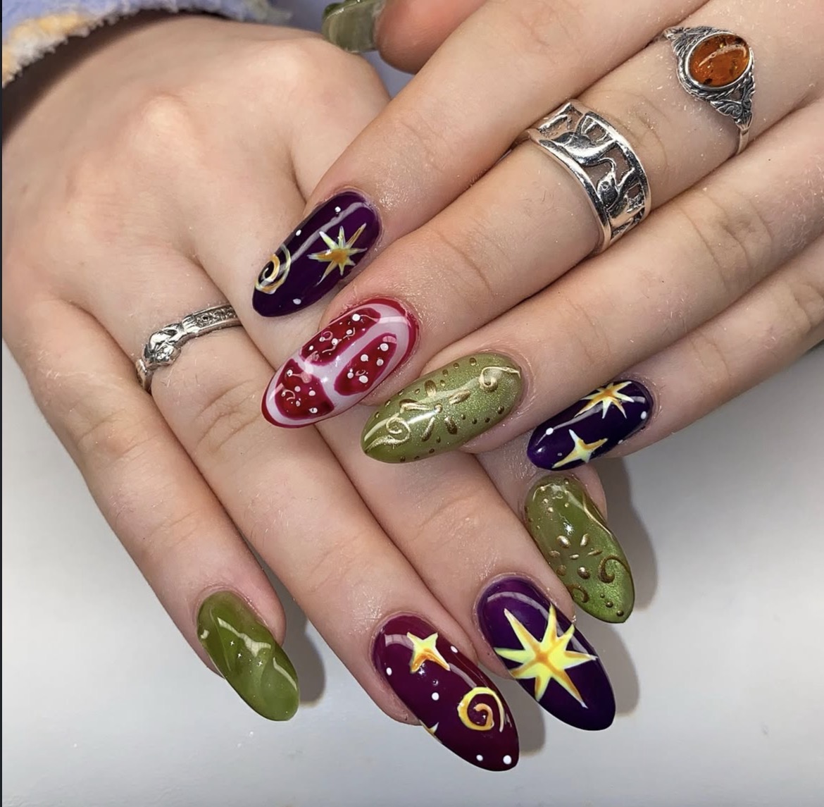 Jewel-tone celestial nail art by PUCA_NAILZ